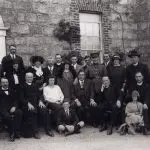 A photo taken in Custume Barracks, Athlone, in August 1923. Seán MacEoin, in uniform, stands near the centre of the photo. Seated to MacEoin's right is John McCormack, the internationally famous tenor, and to his left is Michael Curley, Archbishop of Baltimore in the United States of America. In the aftermath of the 1922 Glasson ambush, Curley denounced the anti-Treaty IRA during a sermon in St. Mary's Church, Athlone - (Athlone Public Library).