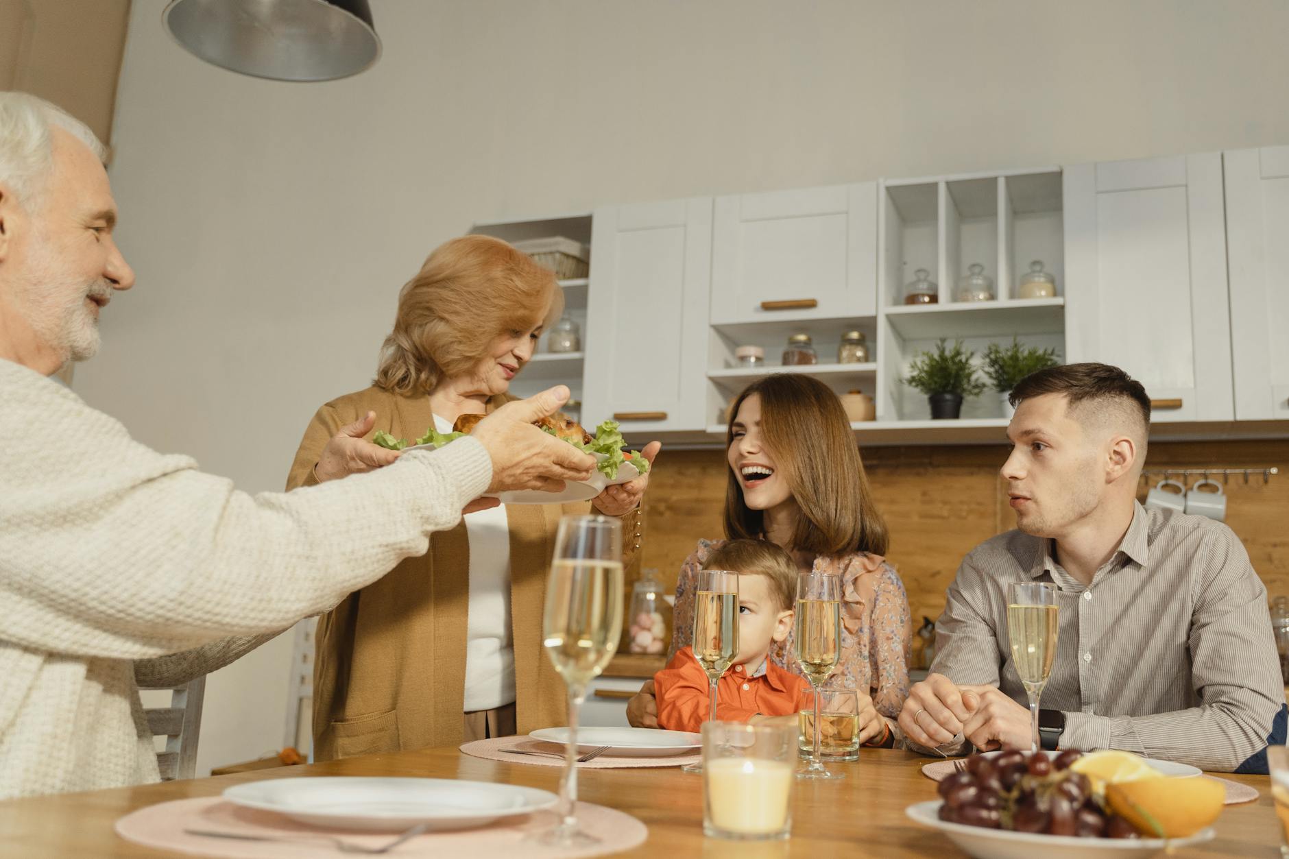 woman in white sweater sitting beside woman in white sweater